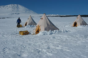Tents in snowy landscape